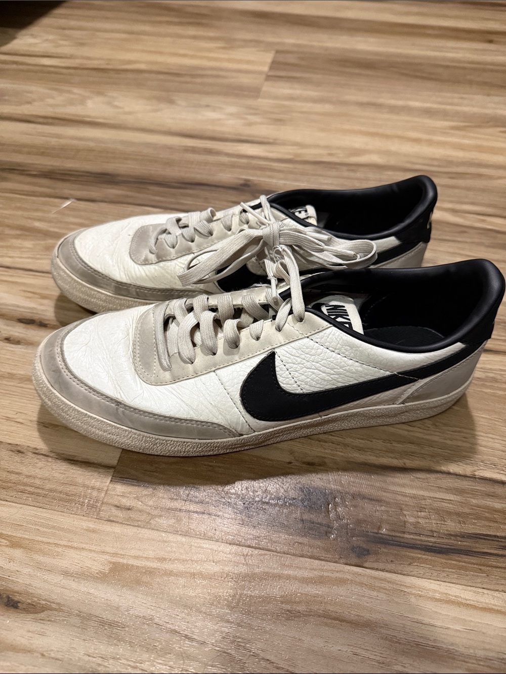 Nike Men’s White Leather Sneakers with Black Swoosh
